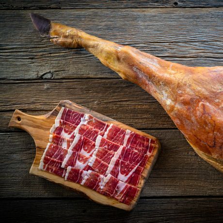 Whole Jamón Ibérico leg with marbled slices, Spanish cured ham sold online in Canada