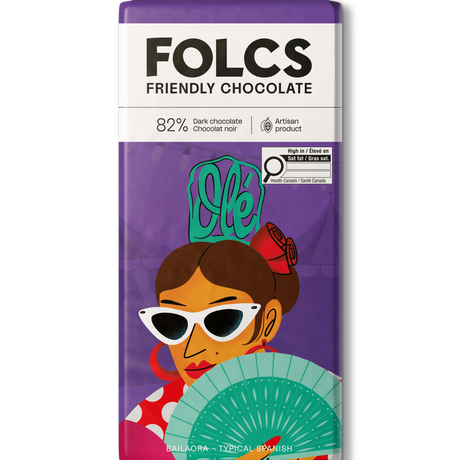 A bar of FOLCS Friendly Chocolate, 82% dark chocolate, featuring a purple wrapper with a colorful illustration of a woman in sunglasses holding a fan.